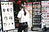 A pedestrian walks past food menu boards in a street in Seoul on Monday. [YONHAP]