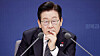 President Lee Jae Myung listens during a policy briefing from the Financial Services Commission (FSC) and the Financial Supervisory Service (FSS) held at the government complex in Seoul on Dec. 19. [JOINT PRESS CORPS]
