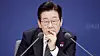 President Lee Jae Myung listens during a policy briefing from the Financial Services Commission (FSC) and the Financial Supervisory Service (FSS) held at the government complex in Seoul on Dec. 19. [JOINT PRESS CORPS]