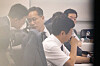 First Vice Finance Minister Lee Hyoung-il, center, speaks with a staff member during a party-government consultation meeting on tax reform held at the National Assembly members' office building in Yeouido, western Seoul, on July 29. [NEWS1]