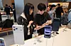 Customers try out the iPhone 17 models at the Apple store in Myeongdong, central Seoul, on Sept. 19. [YONHAP]