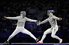 Korea's Choi Se-bin, left, competes with Ukraine's Olga Kharlan in the women's individual sabre bronze medal match during the Paris Olympics at the Grand Palais in Paris on Monday.  [AP/YONHAP]