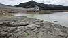 The exposed ground at Obong Reservoir, which supplies 87 percent of tap water in Gangneung, Gangwon lies parched and cracked on Sept. 14. [YONHAP]