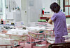 A worker takes care of newborn babies at a postpartum care center in Seoul on Feb. 28, 2024, in this photo unrelated to the story. [JOINT PRESS CORPS]