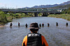 Rescue workers search for a missing person in Jungnang Stream in Howon-dong, Uijeongbu, Gyeonggi on Oct. 16. [YONHAP]