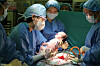 Prof. Won Hye-sung, second from left, of the hospital’s department of obstetrics and gynecology, performs the hospital's 300th delivery of the month in January. [ASAN MEDICAL CENTER]
