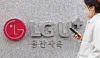 A pedestrian passes by the LG U+ headquarters in Yongsan District, central Seoul, on Dec. 7, 2025. [YONHAP]