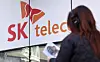 A pedestrian walks by an SK Telecom store in Seoul on Nov. 21, 2025. [NEWS1]