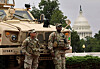 With the dome of the U.S. Capitol in the background, members of the National Guard keep watch outside Union Station after U.S. President Donald Trump ordered an increased federal law enforcement presence to assist in crime prevention in Washington on Aug. 19. [REUTERS/YONHAP]