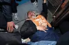 Park Kyoung-seok, chief of the Solidarity Against Disability Discrimination (SADD), lies down across the entrance of subway car at Hyehwa Station, Line 4, as part of SADD's ″We Take the Subway to Work″ campaign on April 21. [NEWS1]