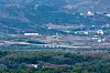 A quiet stretch of the demilitarized zone along the western front is seen from Paju, South Korea, on May 2, showing barriers North Korea installed on the Gyeongui Line road. [YONHAP]