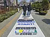 Two people walk on the ″special step on Lee Jae-myung zone″ that was prepared by protesters against the impeachment of President Yoon Suk Yeol on March 15. [JOONGANG ILBO]