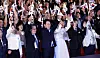 President Lee Jae Myung, center, waves the Korean flag during a ceremony marking the 80th Liberation Day at the Sejong Center for Performing Arts in Jongno District, central Seoul, on Aug. 15. [JOINT PRESS CORPS]