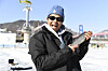 A foreigner holds up a fish he has caught during the 2025 Hwacheon Sancheoneo Festival in Gangwon on Feb. 2. [YONHAP]