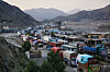 A line of cargo trucks bound for Pakistan is stranded on the Afghan side of the Torkham border crossing, which remained closed after clashes, in Nangarhar province, Afghanistan, Oct. 14. [AP/YONHAP]