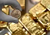 A view of a Krugerrand coin and gold bars kept in the safe deposit boxes room of the Pro Aurum gold house in Munich, Germany, on Jan. 10. [REUTERS/YONHAP]