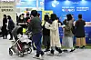 Visitors look around booths at a baby fair held at Coex Magok in Gangseo District, western Seoul on March 27. [YONHAP]