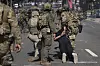 Police detain a man during a protest in the Paramount section of Los Angeles, Saturday, June 7, 2025, after federal immigration authorities conducted operations. [AP/YONHAP]