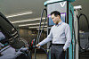 A man charges a Tesla vehicle using Chaevi’s “Supersonic” electric vehicle charger on Feb. 20. [CHAEVI]