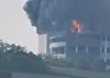 Flames and black smoke from a fire that broke out at a logistics center in Icheon, Gyeonggi, are pictured on May 13. [YONHAP]