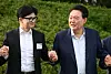 President Yoon Suk Yeol, right, locks hands with new People Power Party Chairman Han Dong-hoon for a commemorative photo ahead of a dinner for the PPP’s new leadership in front of the Yongsan presidential office in central Seoul on Wednesday evening. [PRESIDENTIAL OFFICE]
