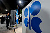 A woman passes by an Organization of the Petroleum Exporting Countries logo during the United Nations climate change conference COP29, in Baku, Azerbaijan on Nov. 13, 2024. [REUTERS/YONHAP]