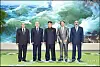 North Korean leader Kim Jong-un, center, poses for a commemorative photo with a Syrian delegation visiting Pyongyang in July 2013 to attend celebrations marking the 'Victory Day' armistice anniversary on July 27. [YONHAP]