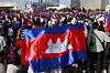 People carry Cambodian flags during a march in Phnom Penh, Cambodia on June 18. [EPA/YONHAP]