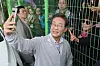 Democratic Party presidential candidate Lee Jae-myung takes a selfie with supporters outside a venue in Jeonju, North Jeolla, after a campaign event on May 7. [YONHAP]