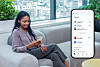 A woman uses a Toss application on her phone in this promotional photo provided by the payment services company. [TOSS]
