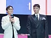 Actors Roh Jae-won and Choi Seung-hyun (T.O.P.) during a fan event for the release of the third season of “Squid Game” (2021-) at Seoul Plaza in central Seoul on June 28. [DANIELA GONZALEZ PEREZ]