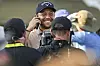 Xander Schauffele smiles as he speaks on his phone after his one-stroke victory in the final round of the 2024 PGA Championship at Valhalla Golf Club on May 19 in Louisville, Kentucky. [GETTY IMAGES]