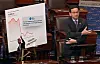 Democratic Sen. Brian Schatz of Hawaii reenacts a photo of Korean Trade Minister Ahn Duk-geun, holding hands with Japanese and Chinese counterparts during a Senate floor speech on April 4. He referenced a photo taken at a Korea-Japan-China trade ministers’ meeting on March 30. [SCREEN CAPTURE]