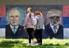 People walk past a mural depicting Russian President Vladimir Putin and U.S. President Donald Trump in Belgrade, Serbia on May 19. [EPA/YONHAP]