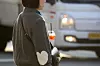 A pedestrian in Daegu holds an iced americano in November 2024. [NEWS1]