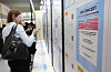 An attendee looks at available positions at the Job Fair for International Students on May 19. [YONHAP]