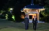 President Yoon Suk Yeol, right, takes a stroll with United Arab Emirates President Mohamed bin Zayed Al Nahyan in the gardens of the presidential residence in Hannam-dong, central Seoul, for a friendly chat to wrap up the UAE leader’s two-day trip to Korea Wednesday. [PRESIDENTIAL OFFICE]