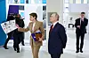 Vladimir Putin, President of Russia, accompanied by Yelena Shmelyova, Chairperson of the Council of the Sirius Federal Territory, views an exhibition at the Sirius Special School of Music on his visit to the Sirius Federal Territory on May 20. [TASS/YONHAP]