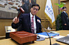 Bank of Korea Gov. Rhee Chang-yong bangs the gavel to open a Monetary Policy Board meeting at the central bank in Seoul on Feb. 26. [JOINT PRESS CORPS]