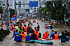 People wade through floodwaters in Nha Trang in Vietnam's coastal province of Khanh Hoa in this photo taken on Nov. 20. [AFP/YONHAP]