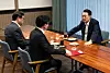 Former President Yoon Suk Yeol, right, sits down for a meeting with then-People Power Party leader Han Dong-hoon, center, on Oct. 21, 2024. [PRESIDENTIAL OFFICE]