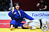 Huh Mi-mi, left, pumps her fist after a victory over Giulia Carn of Italy in the women’s 57-kilogram final at the 2025 Judo Grand Slam Abu Dhabi in Abu Dhabi, United Arab Emirates, on Nov. 29. [YONHAP]