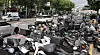 Motorcyles are tightly parked in front of a traditional market in Seoul on May 19. The license plate is stuck at the rear end of the vehicle. [YONHAP]