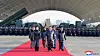 North Korean leader Kim Jong-un, center, and his daughter Ju-ae, to his left, attend a ceremony marking the 80th anniversary of the establishment of the Air Force of the Korean People's Army at the Kalma Airport of the 59th Kil Yong Jo Hero Regiment of the 2nd Air Division on Nov. 28. [KCNA]