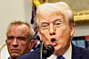 U.S. President Donald Trump, in front of U.S. Secretary of Health and Human Services Robert F. Kennedy Jr., delivers remarks claiming a link between autism and childhood vaccines and the use of the popular pain medication Tylenol for pregnant women and children, which has not been backed by decades of science, at the White House in Washington on Sept. 22.  [REUTERS/YONHAP]