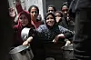 Palestinians wait to receive free food at a food distribution center in Jabalia refugee camp, northern Gaza Strip, on May 19. [XINHUA/YONHAP]