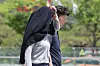 A citizen shields themselves from the heat with a jacket over their head in Gwanghwamun Square in Jongno District, central Seoul, on June 5. [YONHAP]