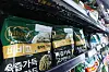 Packs of Bibigo dumplings are stacked at a grocery store in Seoul on March 31. [YONHAP]