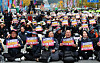 Members of the Korean Confederation of Trade Unions and the National Farmer's Federation rally in downtown Seoul on Wednesday holding banners demanding President Yoon Suk Yeol's resignation. [NEWS1]
