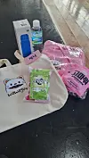 The welcome bag containing a bottle of water, a reusable tumbler, a bag of snacks, a folder and a hoodie T-shirt [YOON SO-YEON]